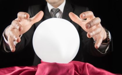 A business person over a crystal ball